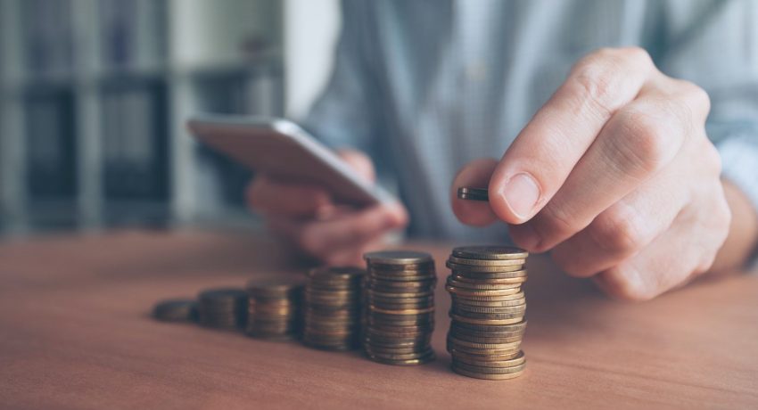 Coin stacker, businessman with stacked money